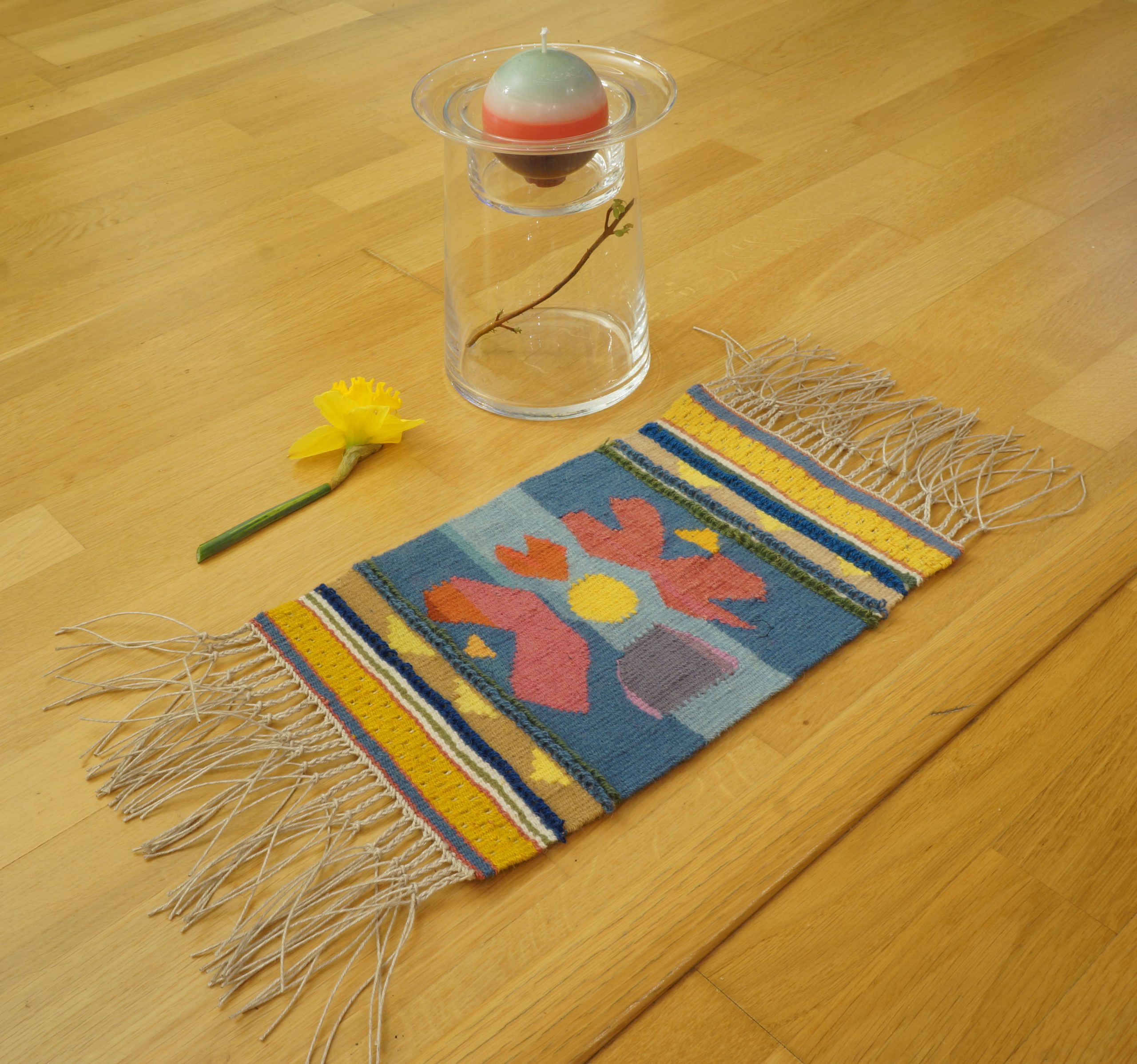 Small flower tapestry and candle